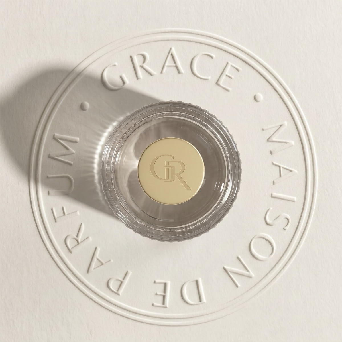 Bottle cap with GR monogram on blind-embossed paper, Grace’ Routine