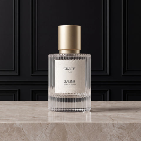 SALINE Extrait de Parfum bottle with gold cap on a stone surface, Grace’ Routine